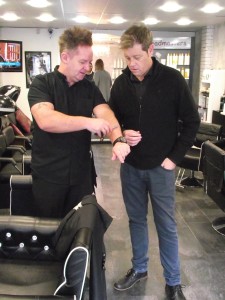 Simon Burgess (right) with Rob Grosvenor (Left) of Headmasters showing Simon Burgess how to hold the razor